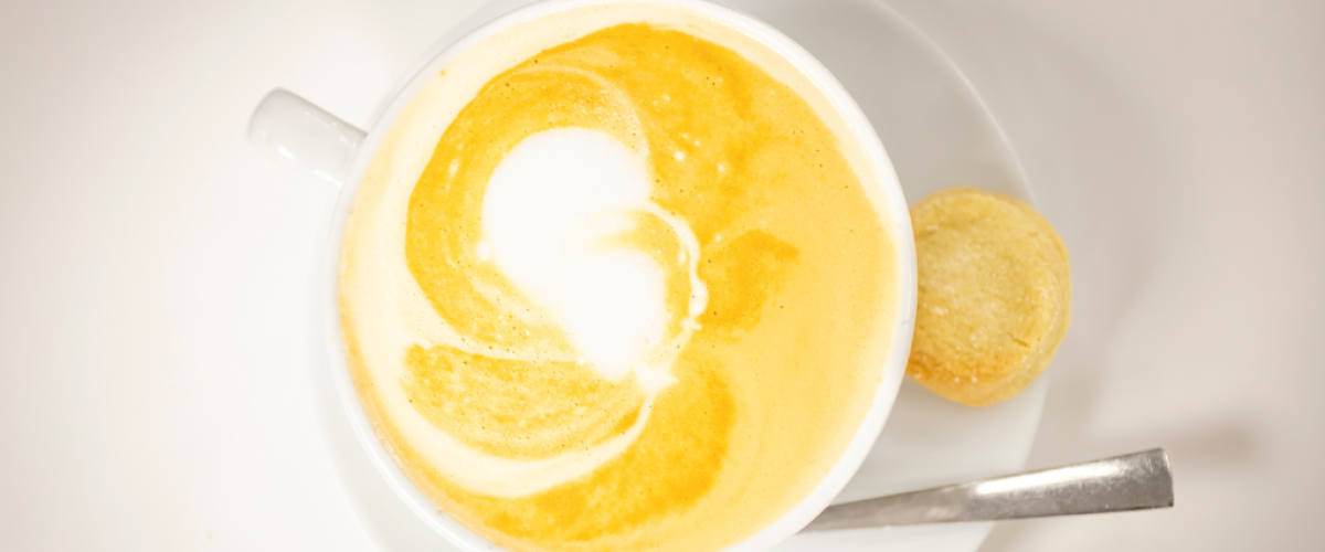 A chai latte in a white mug